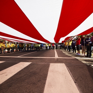 Red Stripes Carried by Marchers